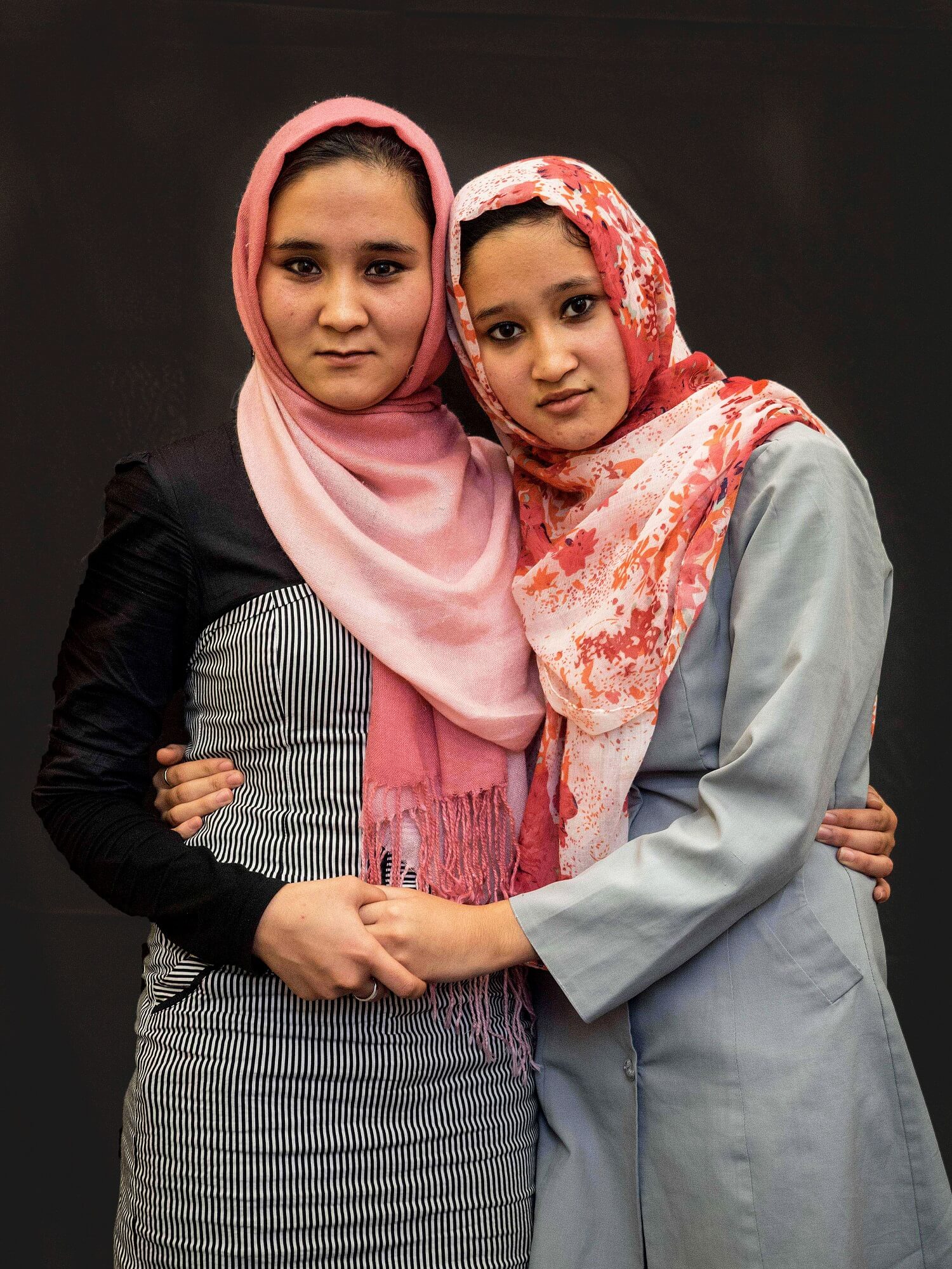 two woman in support of each other